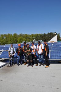 Installing rooftop solar at M’Chigeeng First Nation. 3G trained 10 Band workers on solar system installation. Systems were installed in 2010.